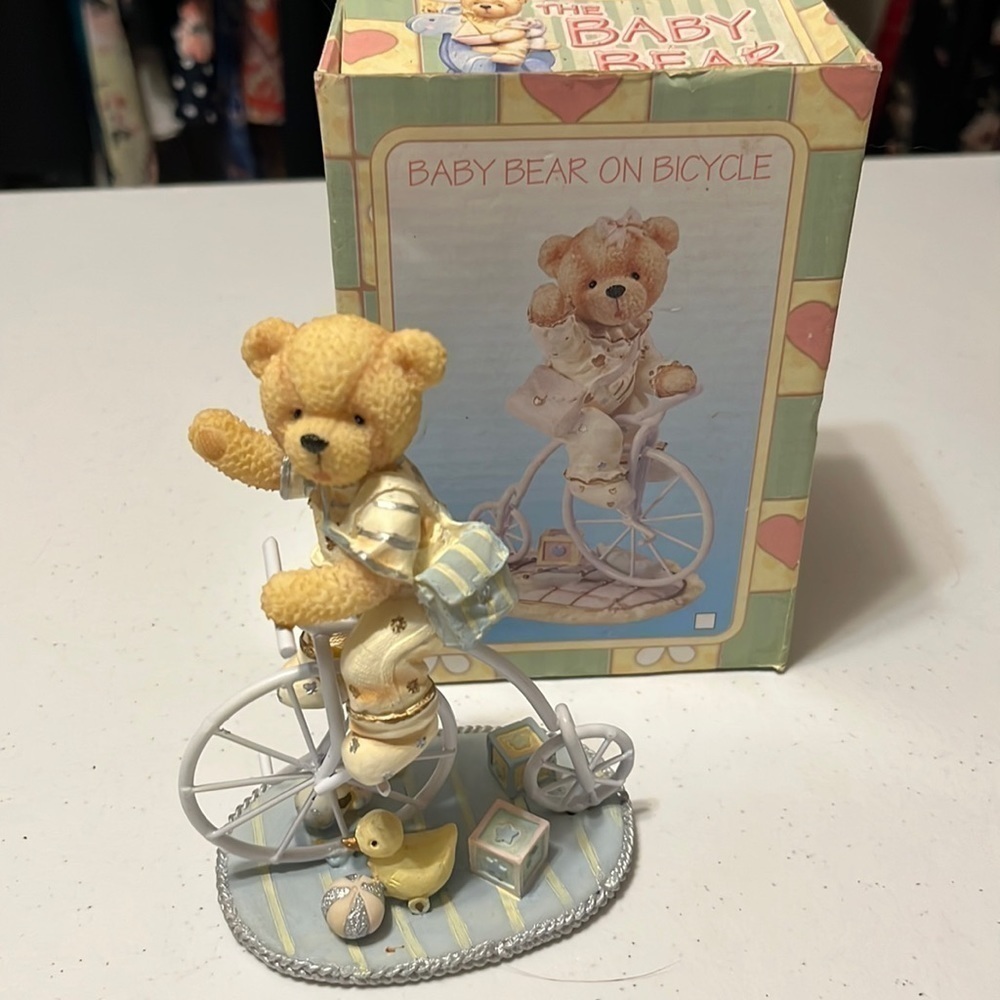 Baby Bear on a tricycle .